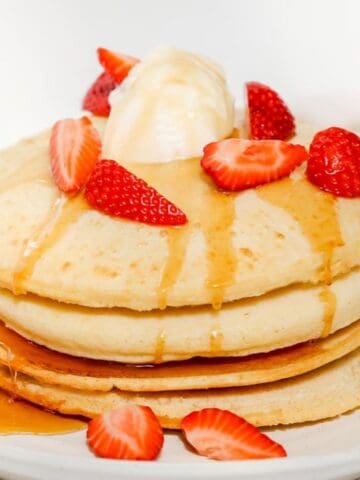 Air fryer pancakes with strawberries and ice cream.