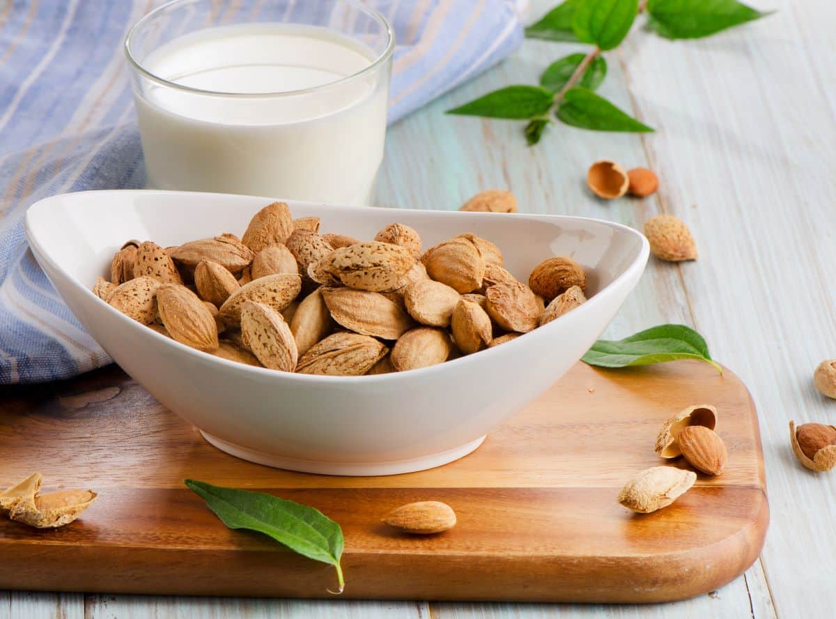 almond milk with a bowl of almonds.