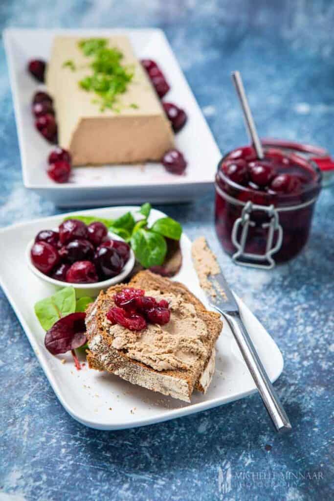 Plate of brad and duck liver parfait and brandied cherries