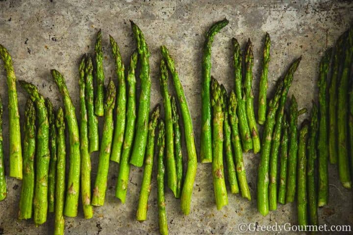 Roasted asparagus in a pan.