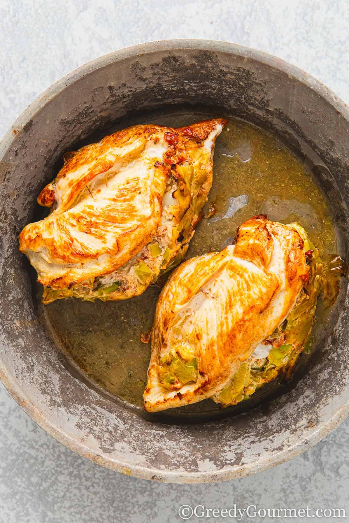 Leek-Stuffed Chicken Breast in a pan.