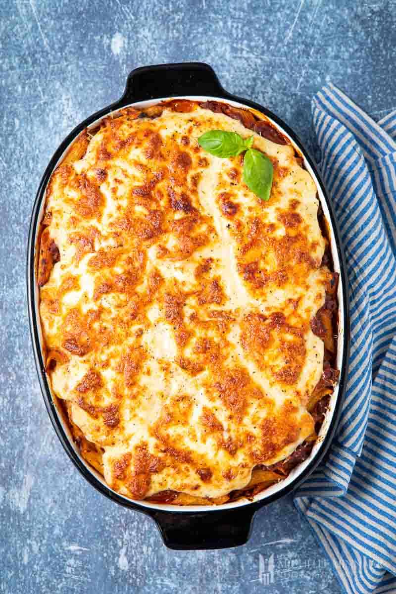 Baked bolognese pasta bake in a dish 