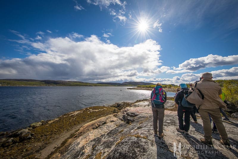 Three people looking at the Norway Mountains