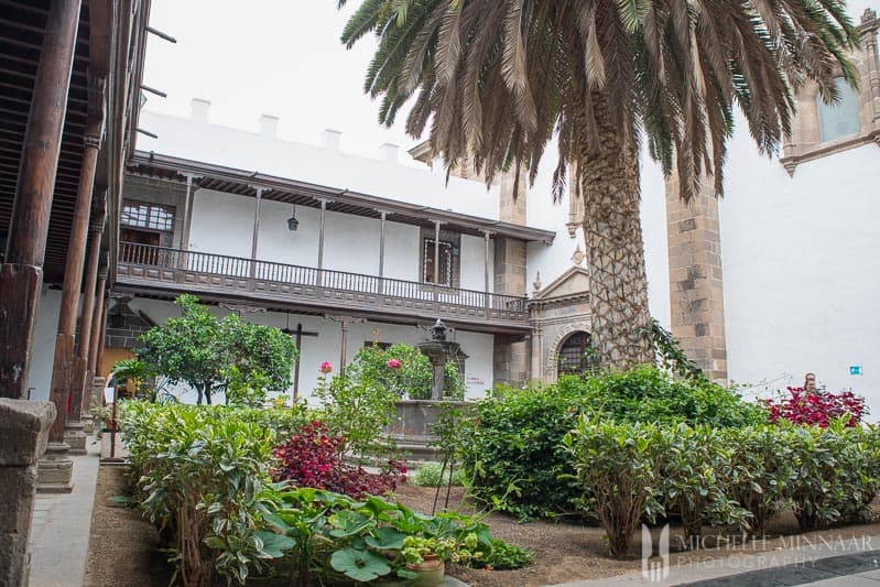 A landscaped are in front of a church 