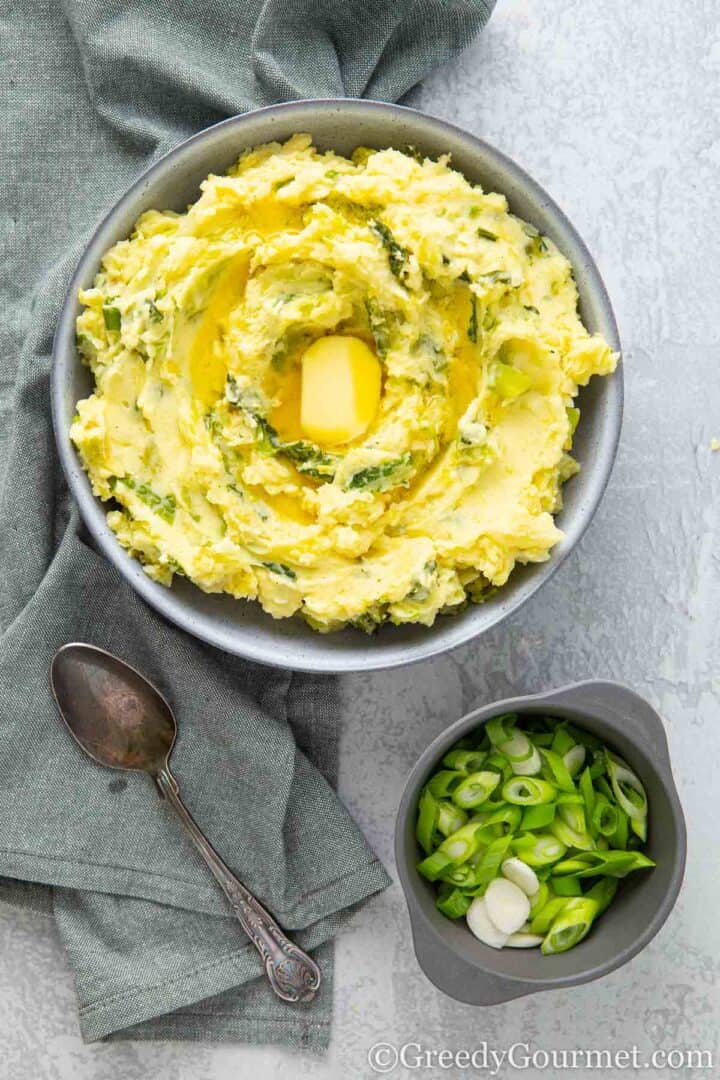 Creamy Colcannon served in a grey bowl.