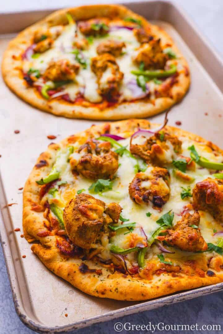 Freshly baked chicken tikka pizza.