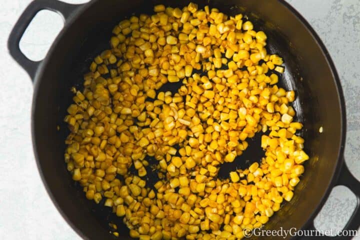 fry sweetcorn in a pan.