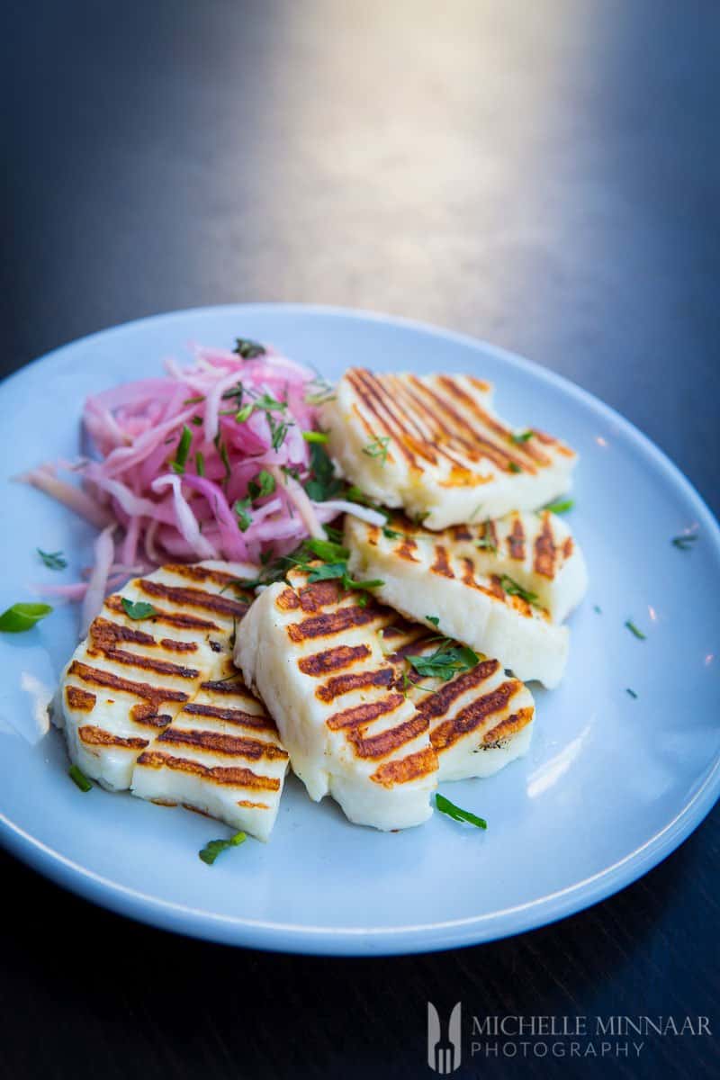 A plate of Grilled Halloumi and coleslaw 