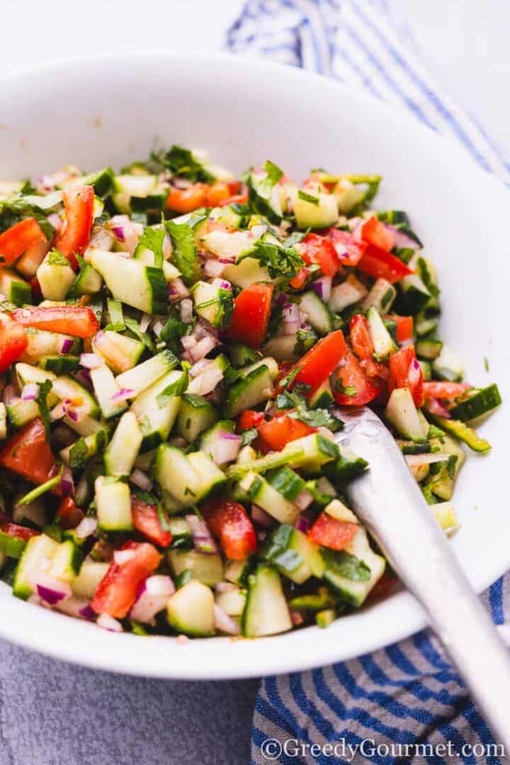 Kachumber Salad in a white bowl.