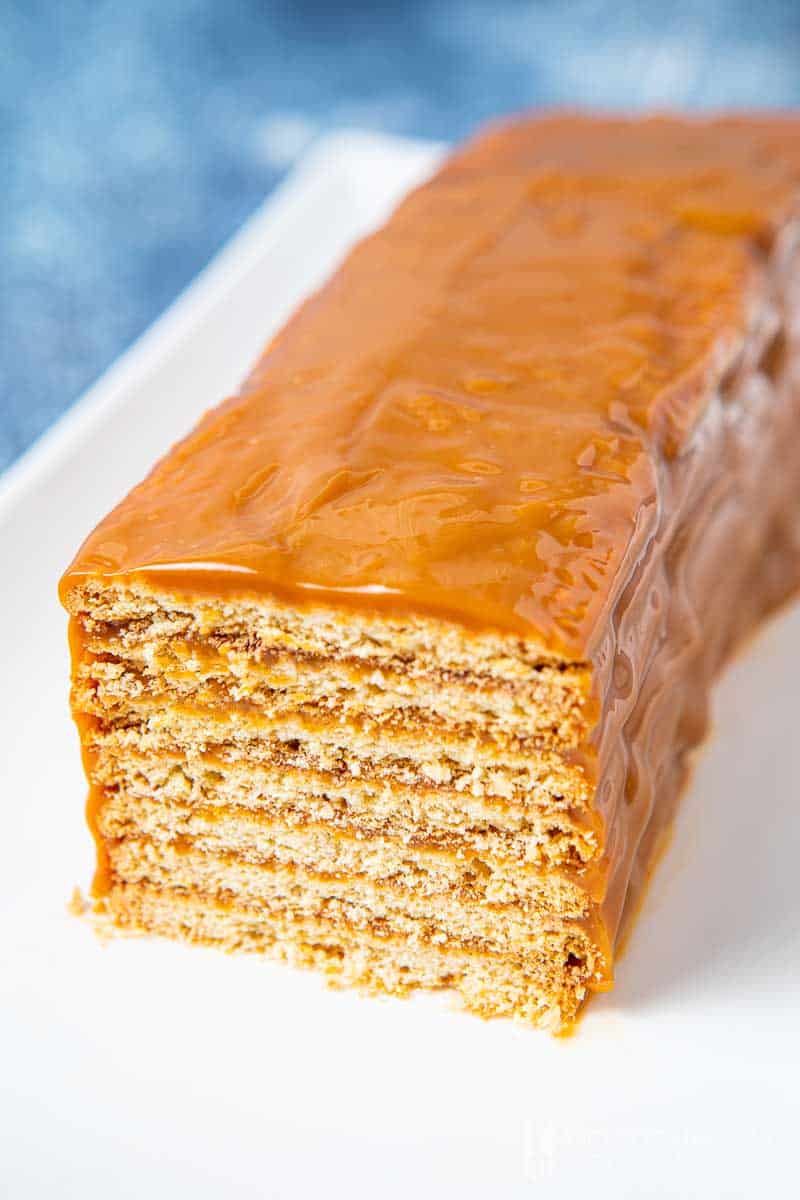 Layered cookies covered in caramel sauce 