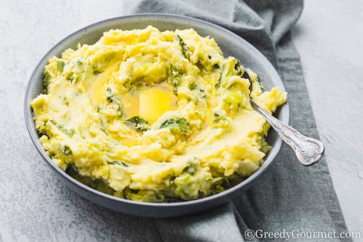 Creamy Colcannon served in a grey bowl.