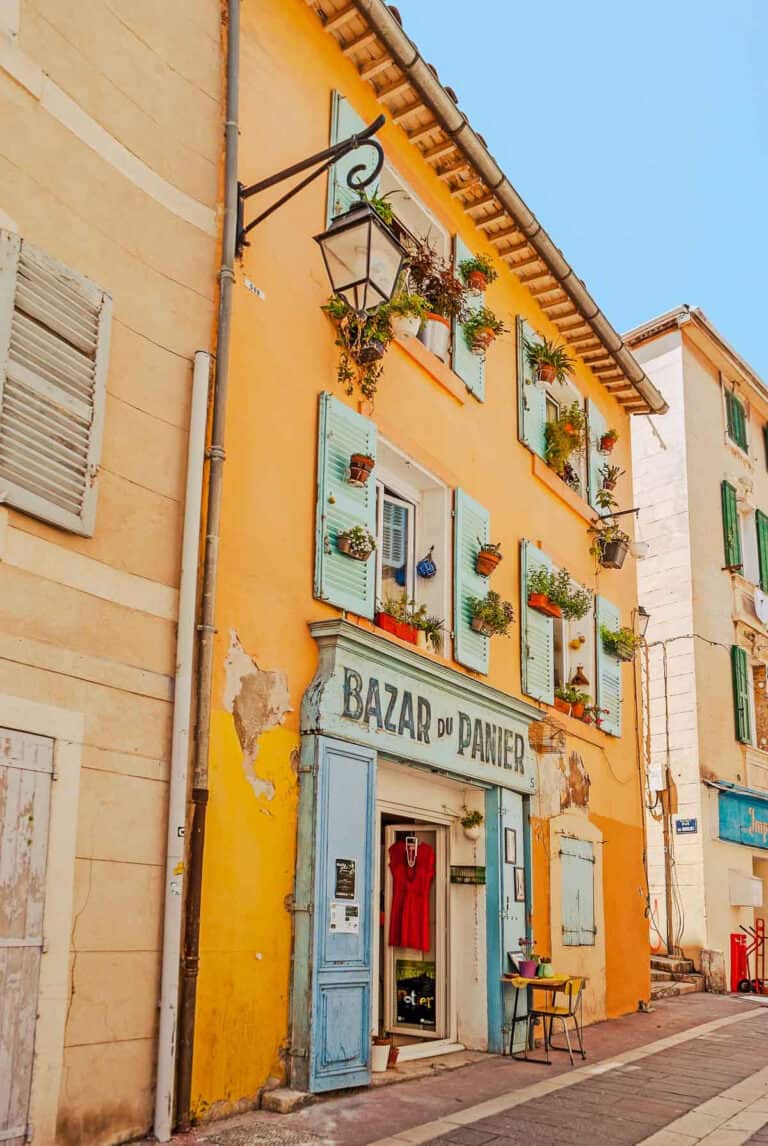 Old streed with bright orange buildings.