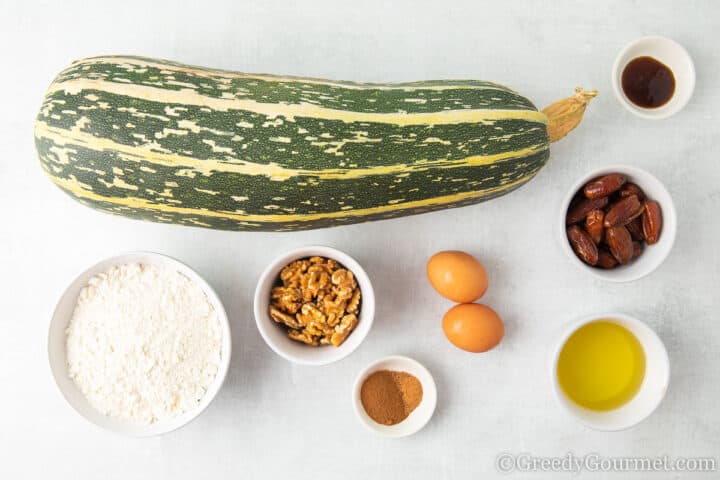 Ingredients for marrow cake laid on a table. 