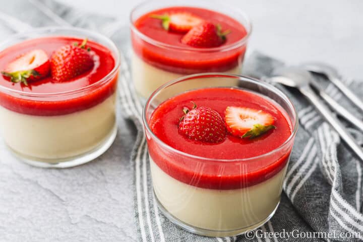 White Chocolate Panna Cotta served in small glass bowls.