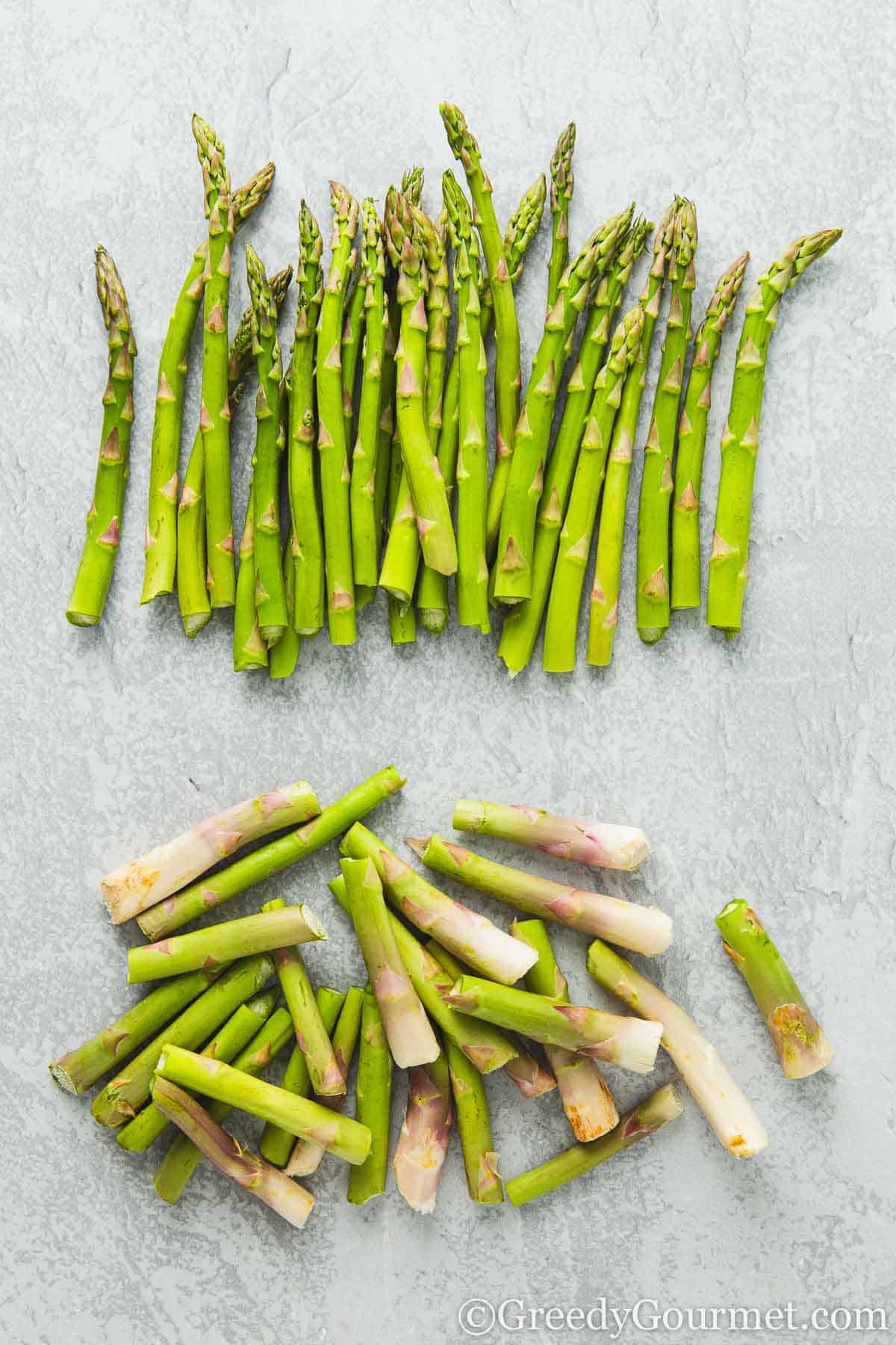 Chopping the ends off asparagus.