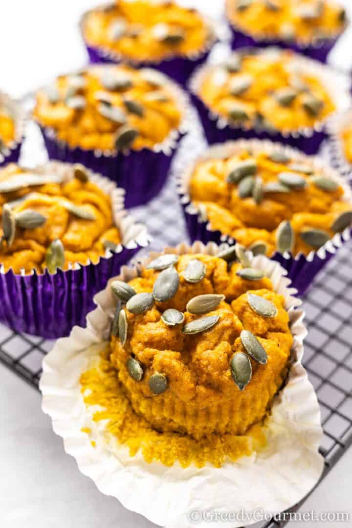 Protein pumpkin muffins on a cooling rack.