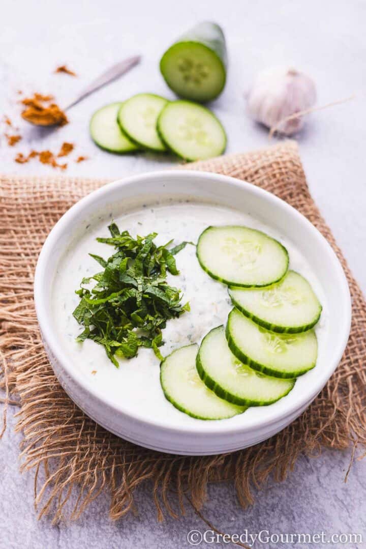 Cucumber raita in a bowl.