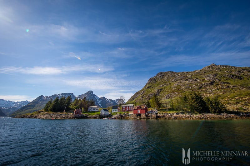 A few small buildings on a mountainside