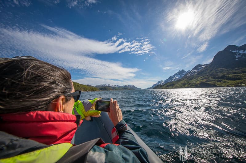 A person taking pictures of the mountains 