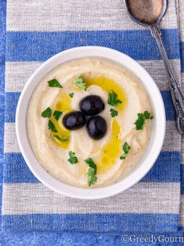 White bowl full of a creamy skordalia recipe