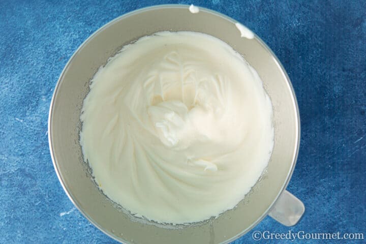 Bowl of whipped egg whites to make a yule log recipe